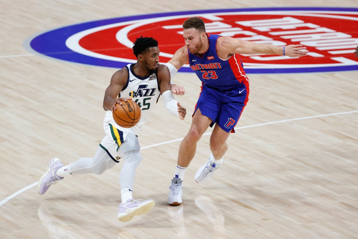 Blake Griffin (23) guards Donovan Mitchell (45) in a matchup between the Jazz and the Pistons