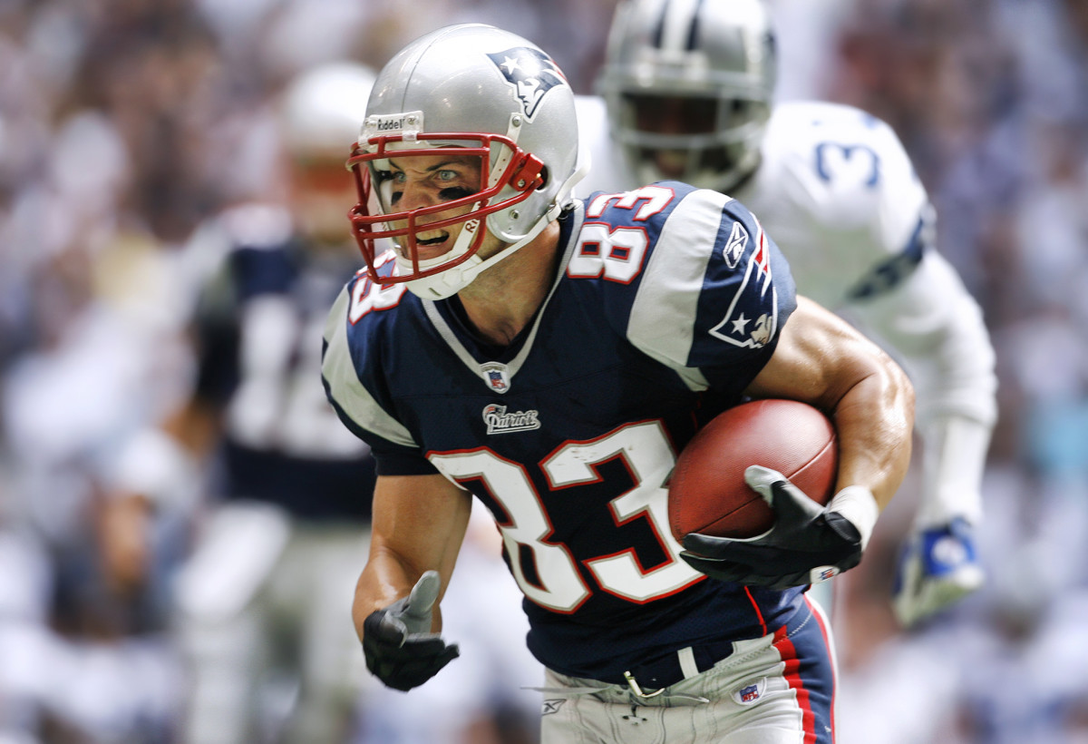 Patriots receiver Wes Welker runs after catching a pass against the Cowboys