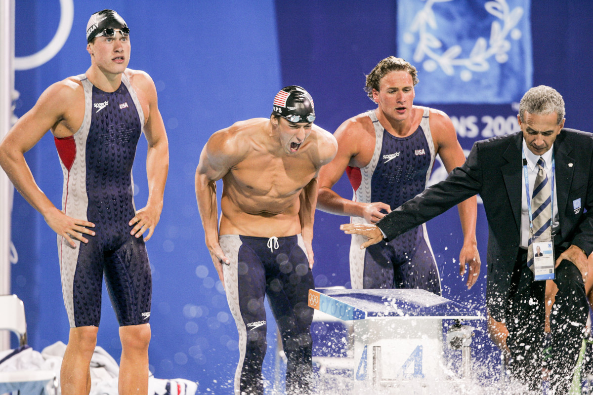 Phelps (center) cheered Keller to a 4x200 win over the Aussies in Athens.