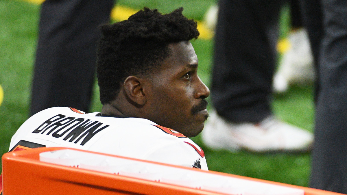 Bucs receiver Antonio Brown sits on the bench during a game against the Lions