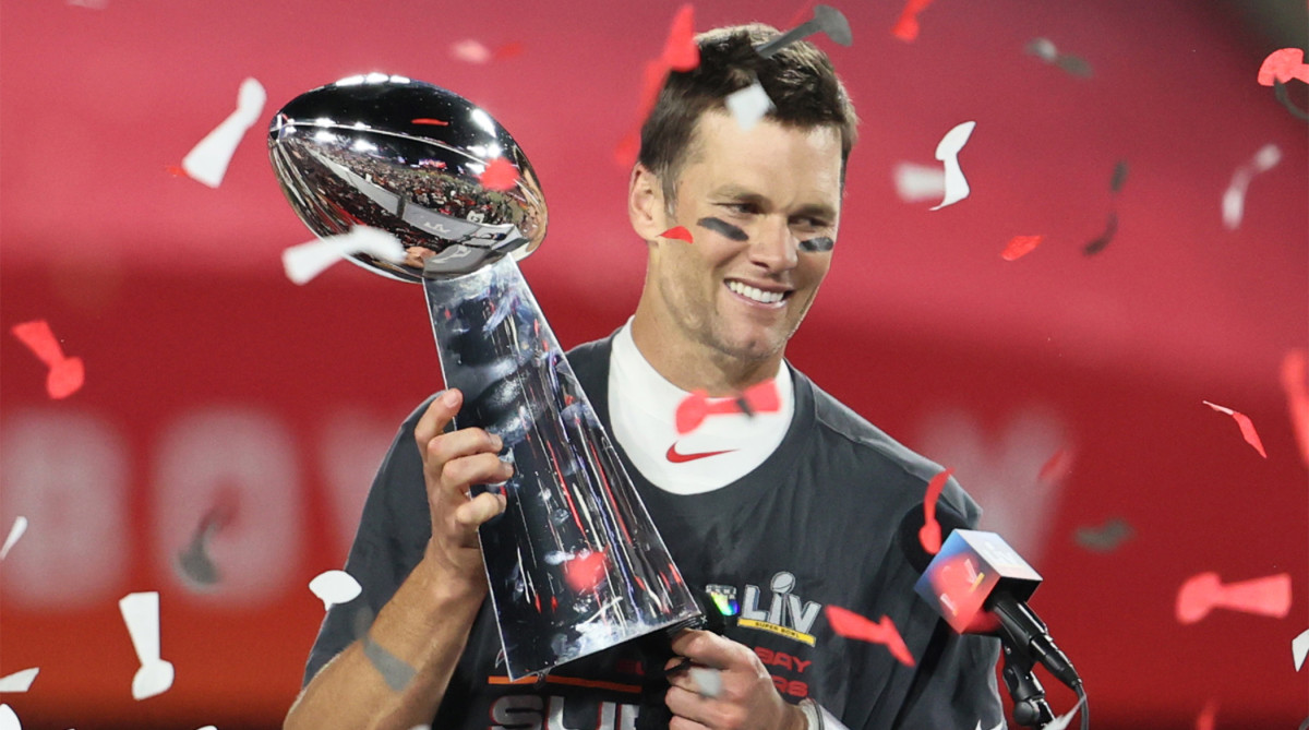 Feb 7, 2021; Tampa, FL, USA; Tampa Bay Buccaneers quarterback Tom Brady (12) hoists the Vince Lombardi Trophy after defeating the Kansas City Chiefs in Super Bowl LV at Raymond James Stadium.
