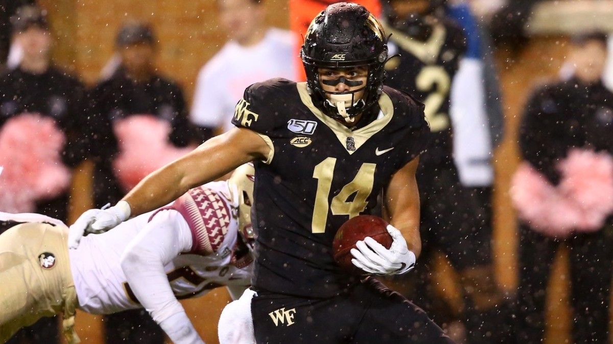 Surratt catches a pass against Florida State Seminoles linebacker Emmett Rice. 