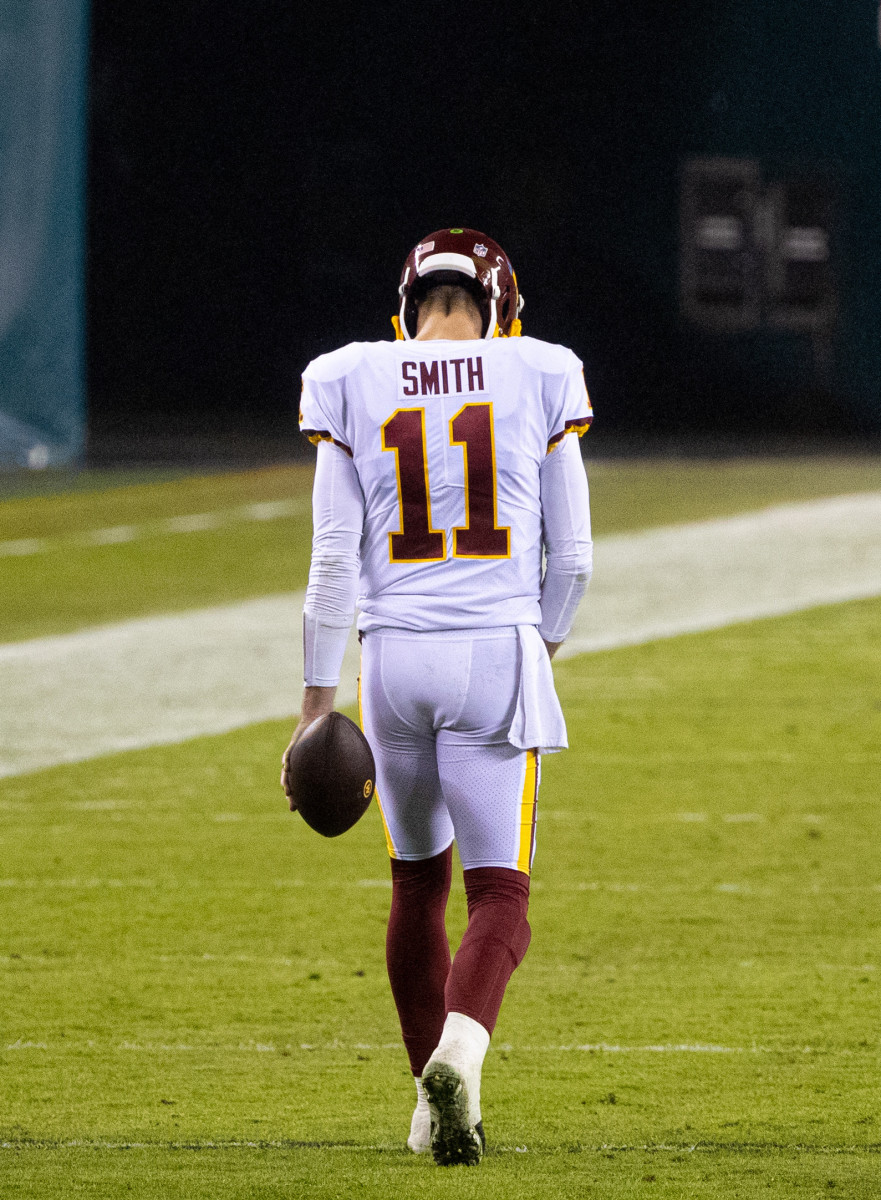 Jan 3, 2021; Philadelphia, Pennsylvania, USA; Washington Football Team quarterback Alex Smith (11) walks up the field at the end of the third quarter against the Philadelphia Eagles at Lincoln Financial Field.