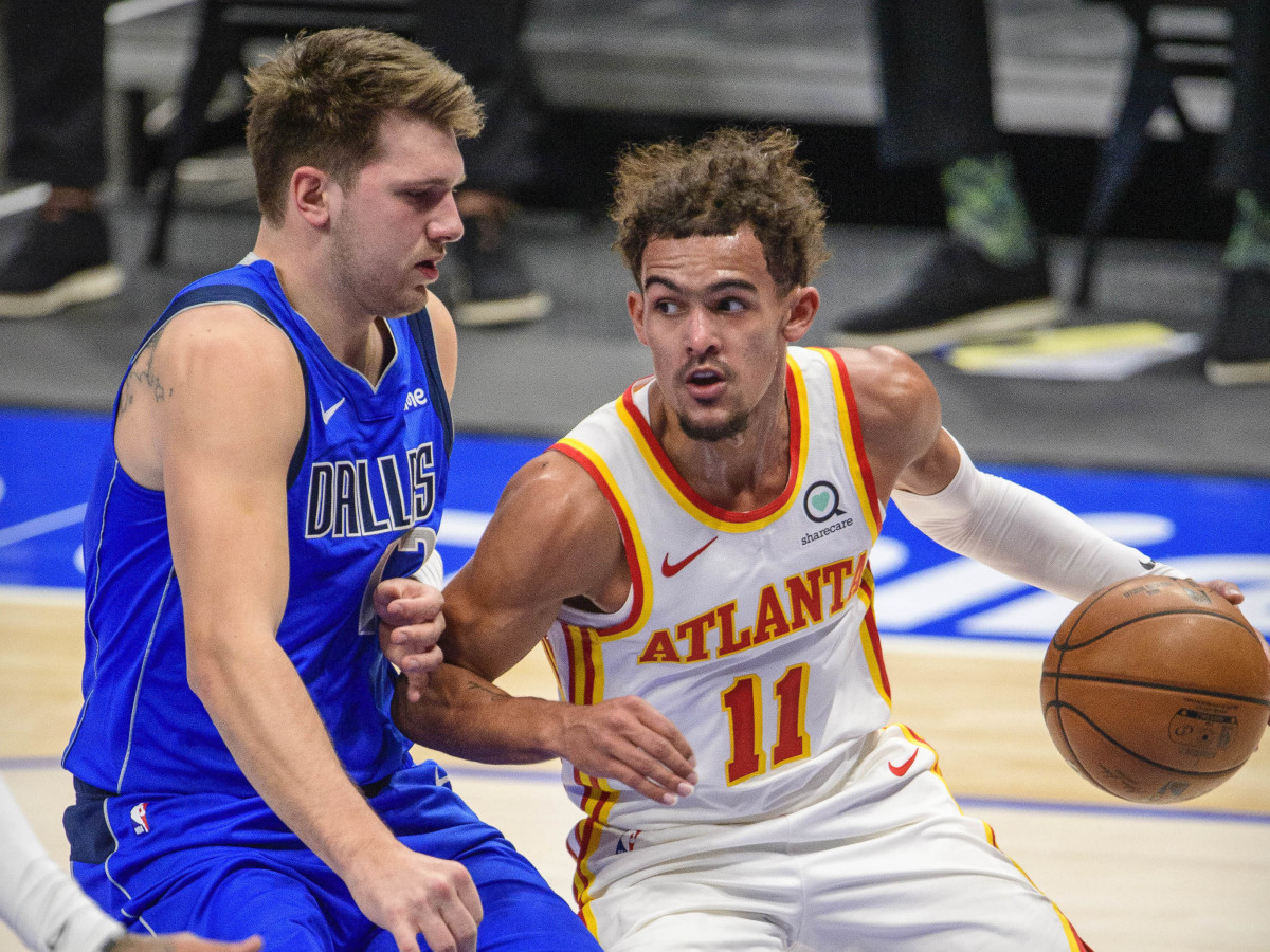 Dallas Mavericks guard Luka Doncic (77) defends against Atlanta Hawks guard Trae Young (11) during the first quarter at the American Airlines Center.