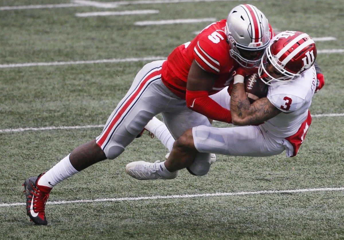 Ohio State Buckeyes linebacker Baron Browning (5) hits Indiana Hoosiers wide receiver Ty Fryfogle (3) during the first quarter of a NCAA Division I football game between the Ohio State Buckeyes and the Indiana Hoosiers on Saturday, Nov. 21, 2020 at Ohio Stadium in Columbus, Ohio. Cfb Indiana Hoosiers At Ohio State Buckeyes