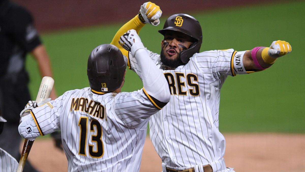 Fernando Tatis Jr. and Manny Machado celebrate against the Cardinals at Petco Park.