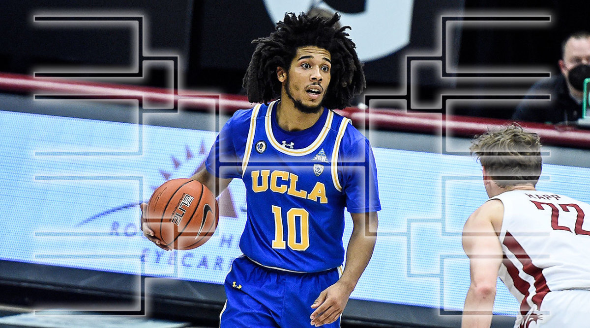 UCLA guard Tyger Campbell dribbles