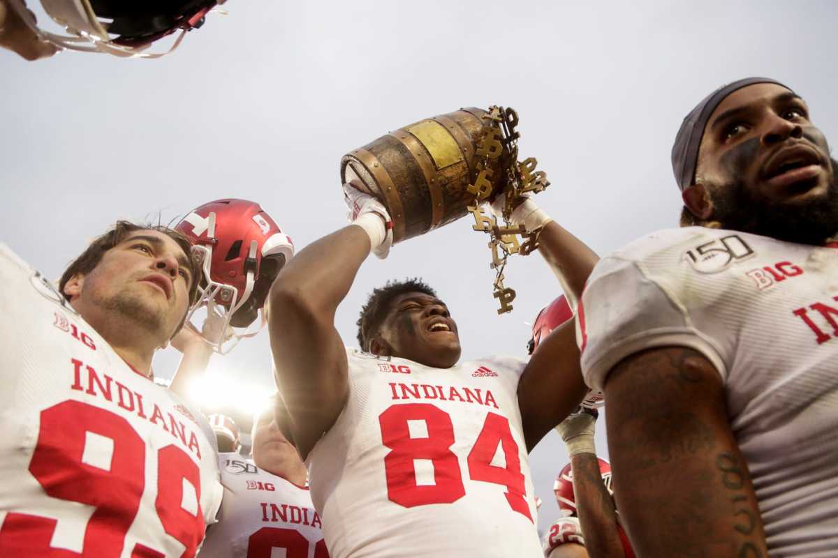 Indiana tight end Turon Ivy Jr. (84) hoists the Oaken Bucket as Indiana celebrates defeating Purdue, 44-41 in double overtime to win the Old Oaken Bucket, Saturday, Nov. 30, 2019 at Ross-Ade Stadium.