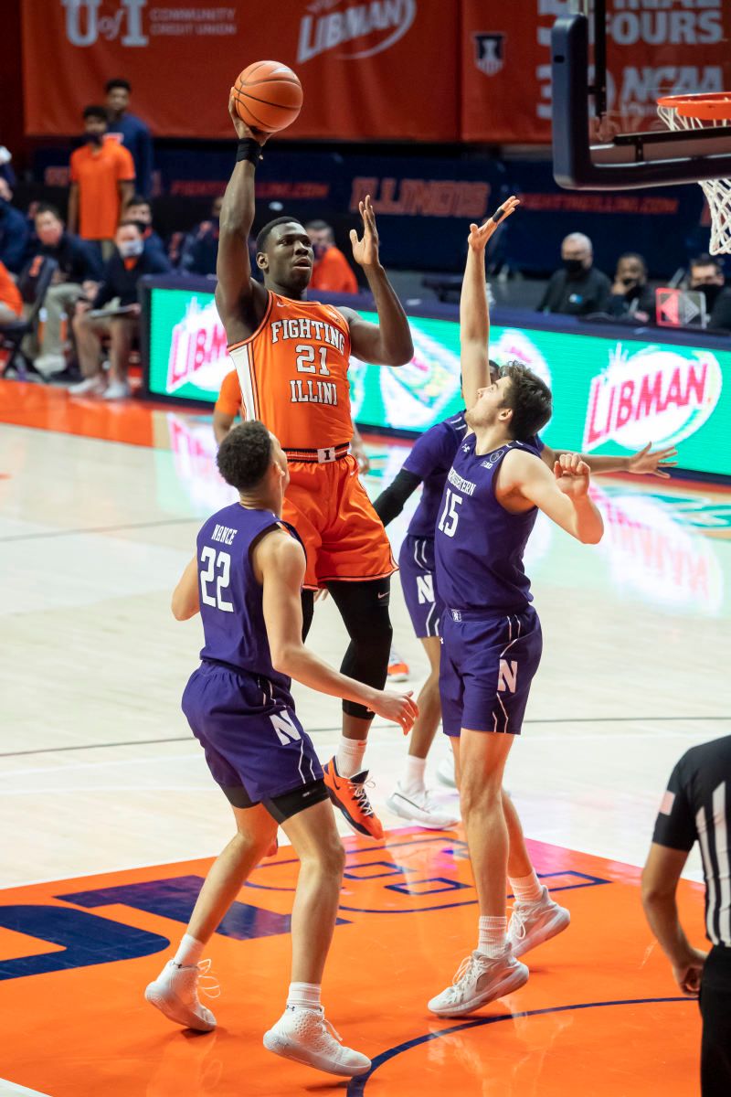 Illinois Fighting Illini center Kofi Cockburn (21) shoots against Northwestern Wildcats center Ryan Young (15) during the first half at the State Farm Center.