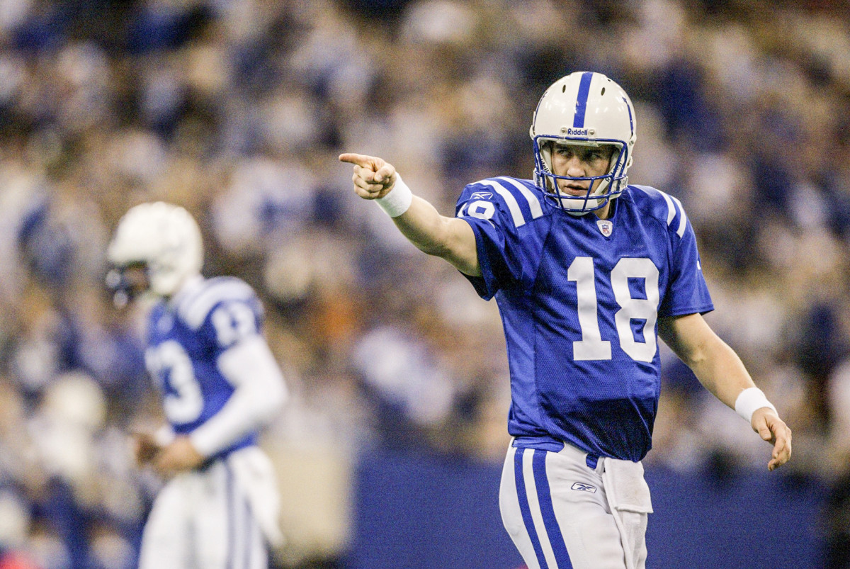 Peyton Manning points to a teammate while playing with the Colts