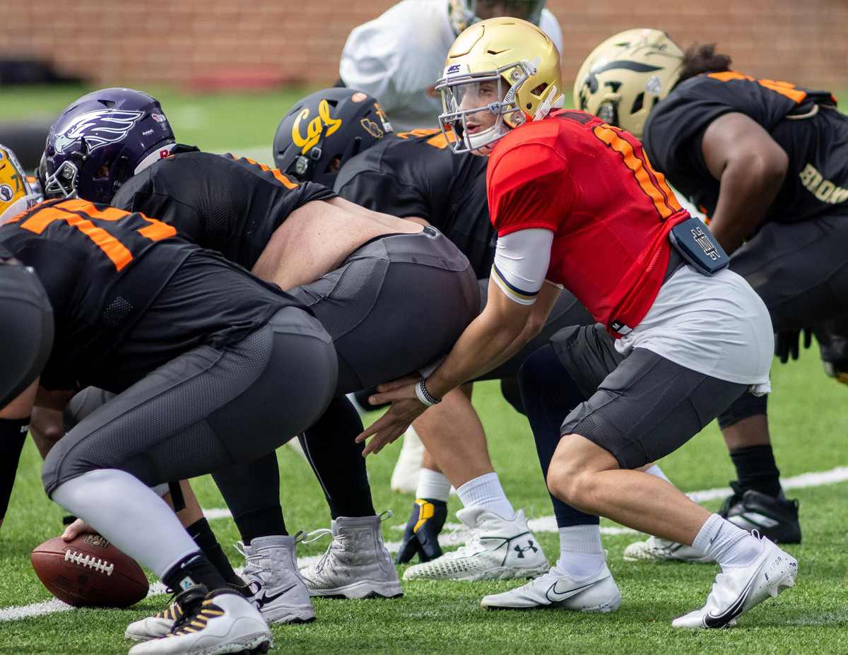 Ian Book prepares to take a snap during Senior Bowl practice