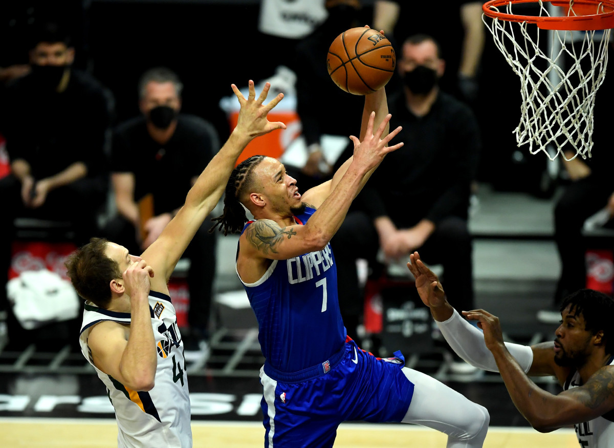 Feb 17, 2021; Los Angeles, California, USA; Los Angeles Clippers guard Amir Coffey (7) moves past Utah Jazz forward Bojan Bogdanovic (44) for a basket in the second quarter of the game at Staples Center. Mandatory Credit: Jayne Kamin-Oncea-USA TODAY Sports