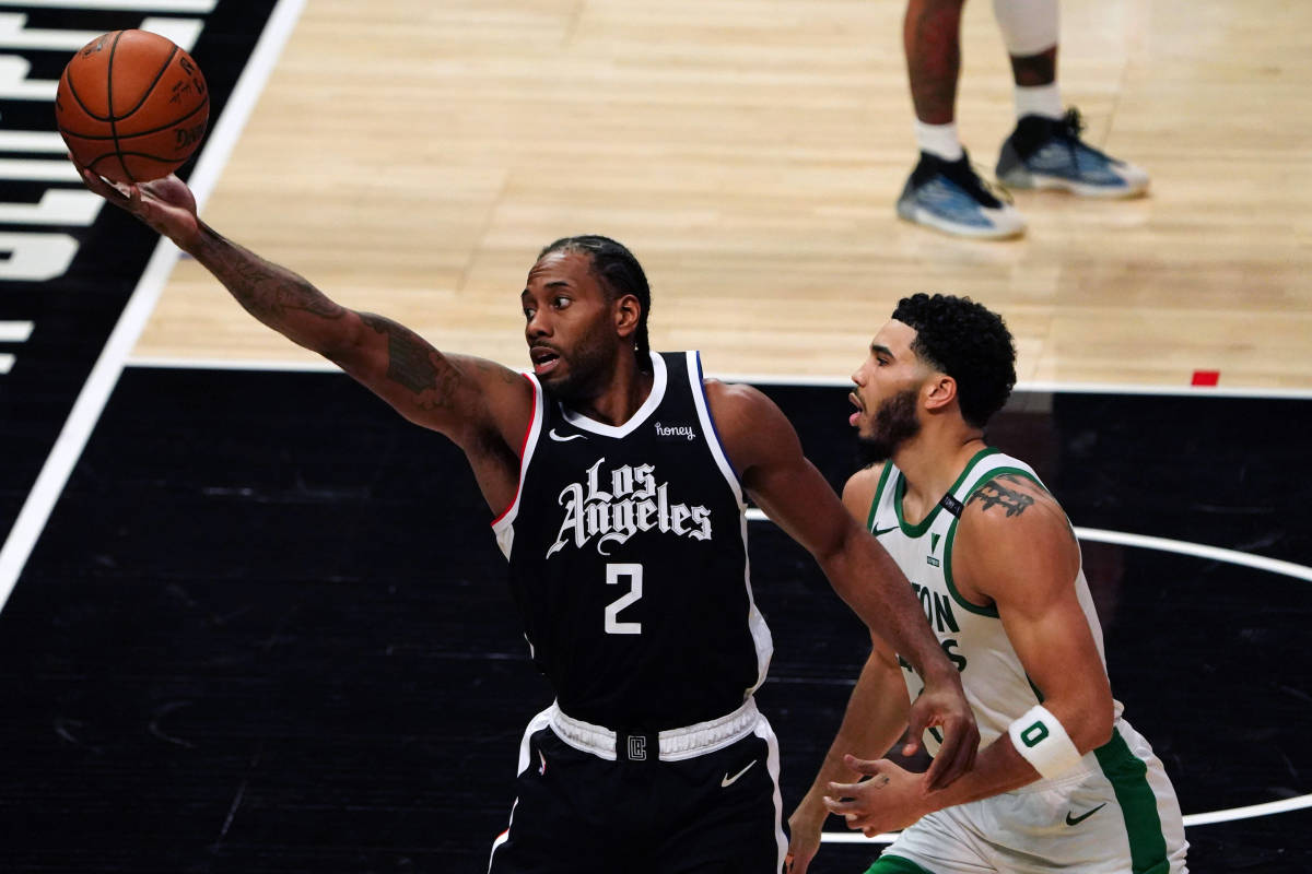 Feb 5, 2021; Los Angeles, California, USA; LA Clippers forward Kawhi Leonard (2) is defended by Boston Celtics forward Jayson Tatum (0) in the third quarter at Staples Center. Mandatory Credit: Kirby Lee-USA TODAY Sports