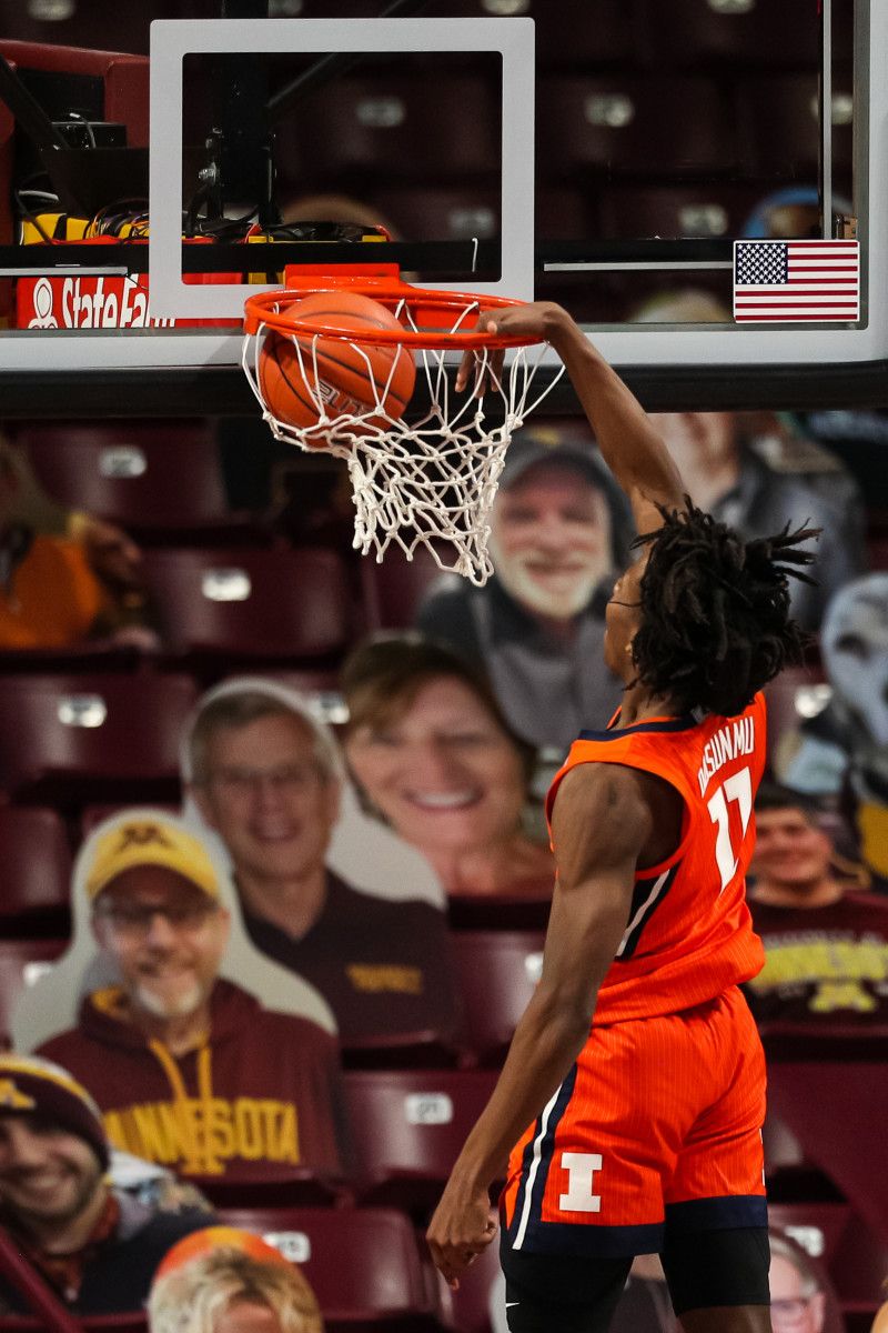 Illinois Fighting Illini guard Ayo Dosunmu (11) dunks the ball against the Minnesota Golden Gophers in the first half at Williams Arena.