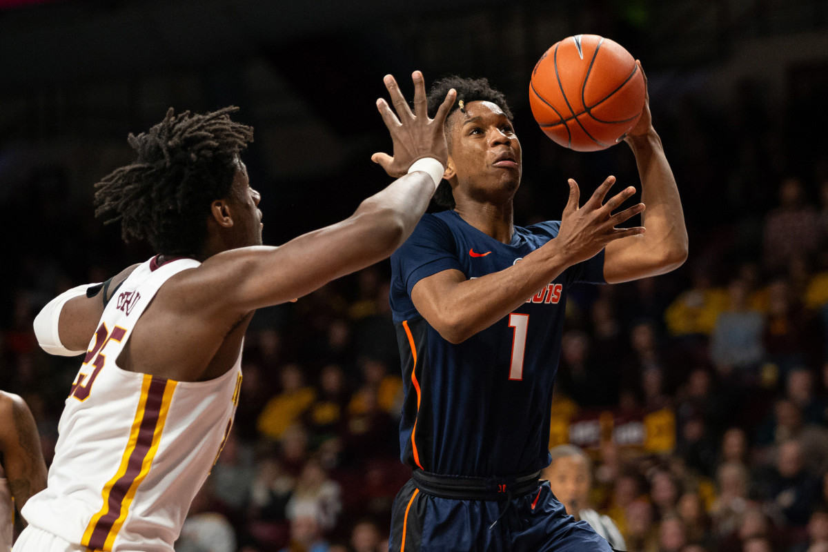Illinois Fighting Illini guard Trent Frazier (1) drives to the basket as Minnesota Gophers center Daniel Oturu (25) defends during the second half at Williams Arena.