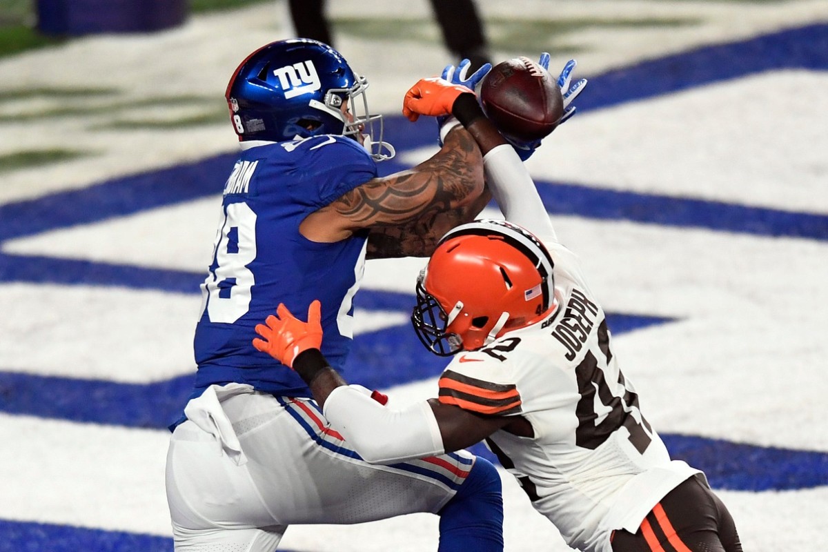 New York Giants tight end Evan Engram (88) cannot come up with the touchdown pass with pressure from Cleveland Browns safety Karl Joseph (42) during a game at MetLife Stadium on Sunday, December 20, 2020, in East Rutherford.