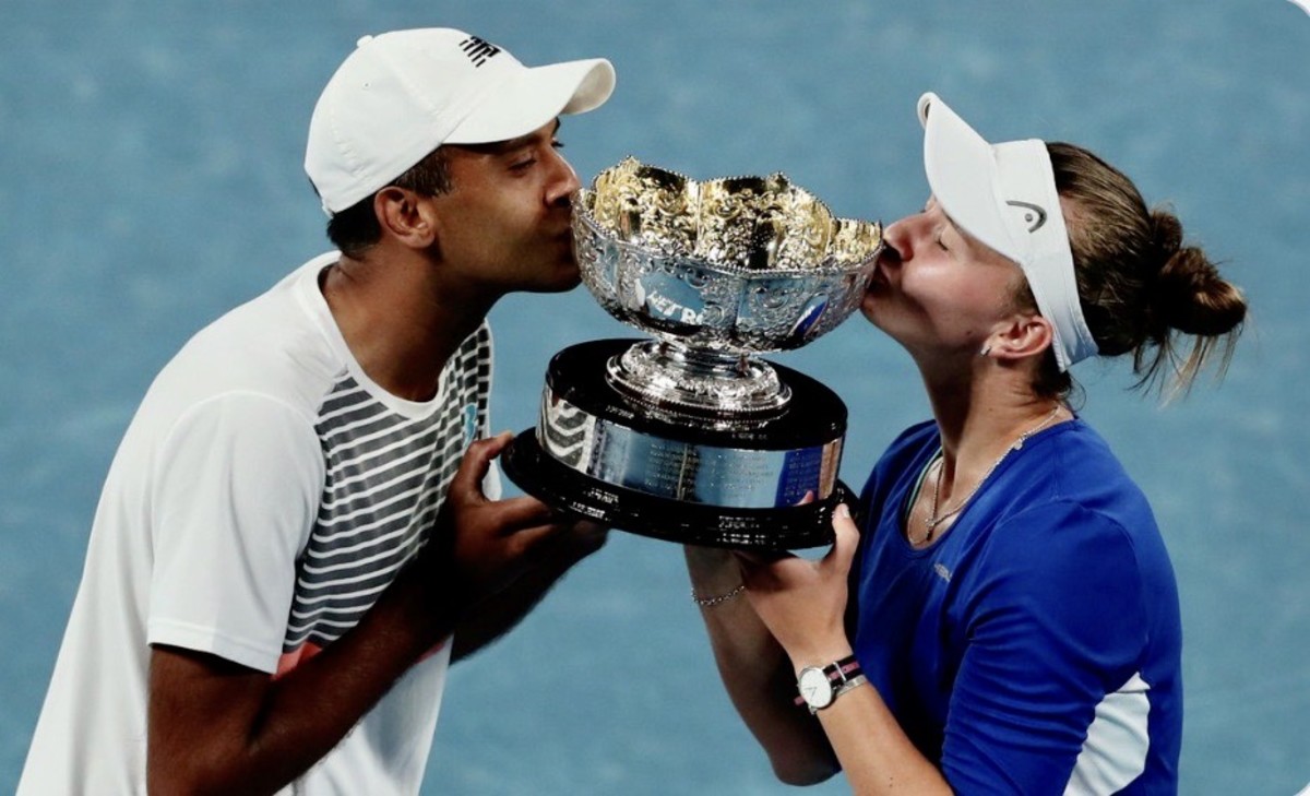 Rajeev Ram and Barbora Krejčíková celebrate their mixed doubles title at the Australian Open