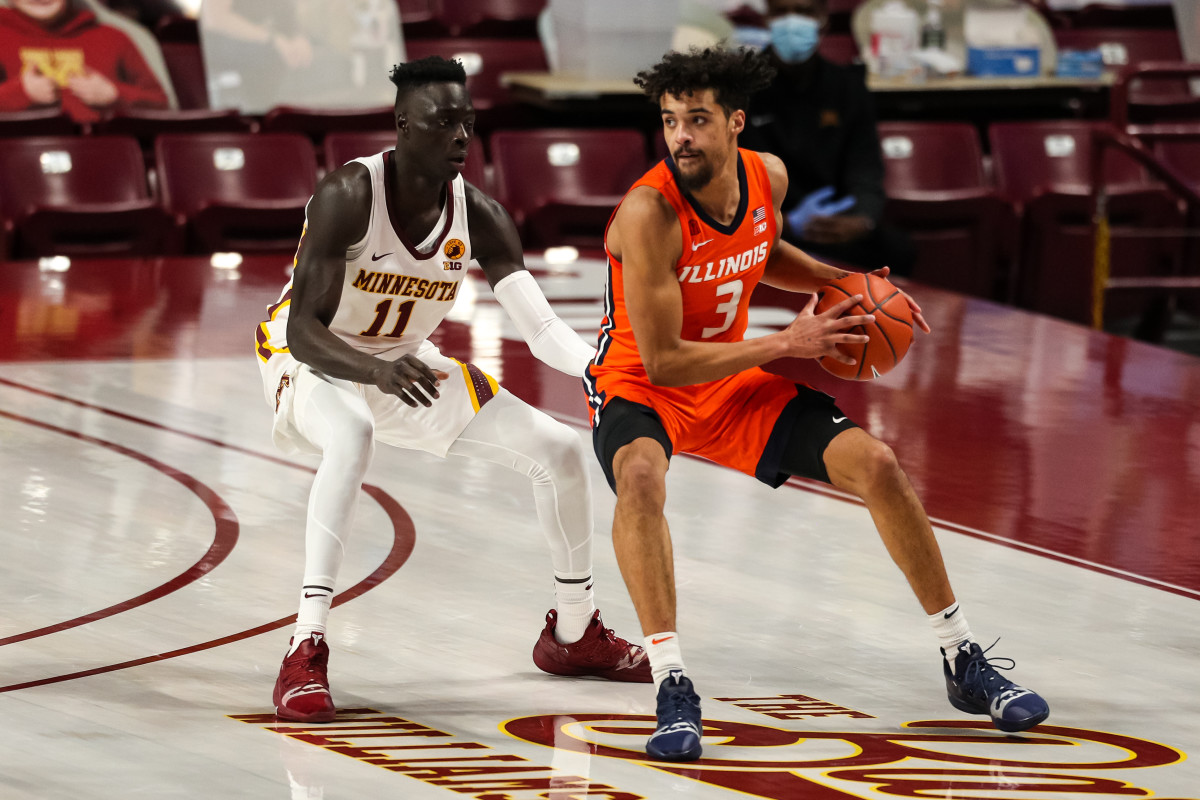 Illinois Fighting Illini guard Jacob Grandison (3) in action while Minnesota Golden Gophers guard Both Gach (11) defends in the first half at Williams Arena.