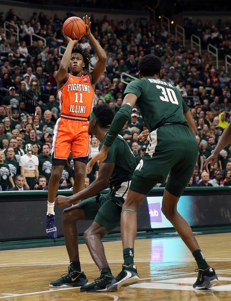 Illinois Fighting Illini guard Ayo Dosunmu (11) attempts a three point basket over Michigan State Spartans forward Gabe Brown (44) during the first half of the 2019 game at the Breslin Center.