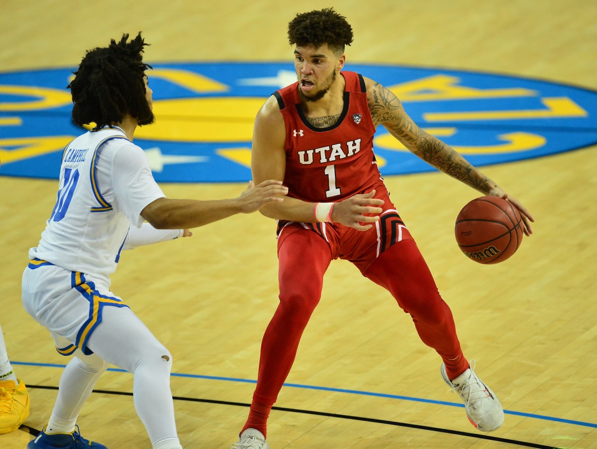 Dec 31, 2020; Los Angeles, California, CA; Utah Utes forward Timmy Allen (1) controls the ball against UCLA Bruins guard Tyger Campbell (10) during the second half at Pauley Pavilion.