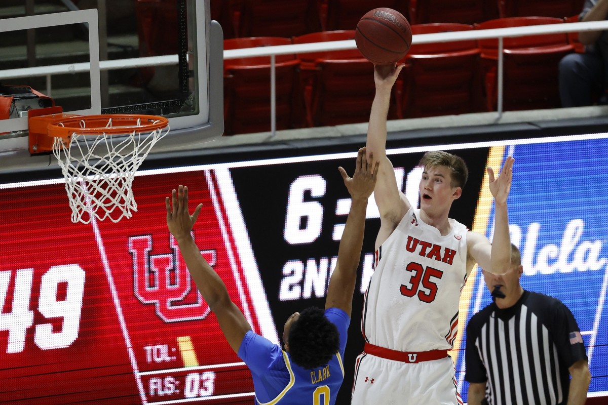 Feb 25, 2021; Salt Lake City, Utah, UCA; Utah Utes center Branden Carlson (35) shoots over UCLA Bruins guard Jaylen Clark (0) in the second half at Jon M. Huntsman Center.