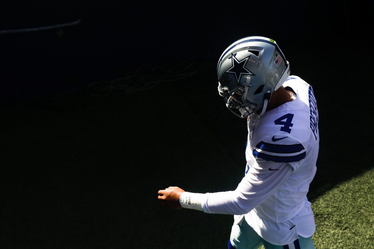 Dallas Cowboys quarterback Dak Prescott (4) walks to the locker room following pregame warmups against the Seattle Seahawks at CenturyLink Field.