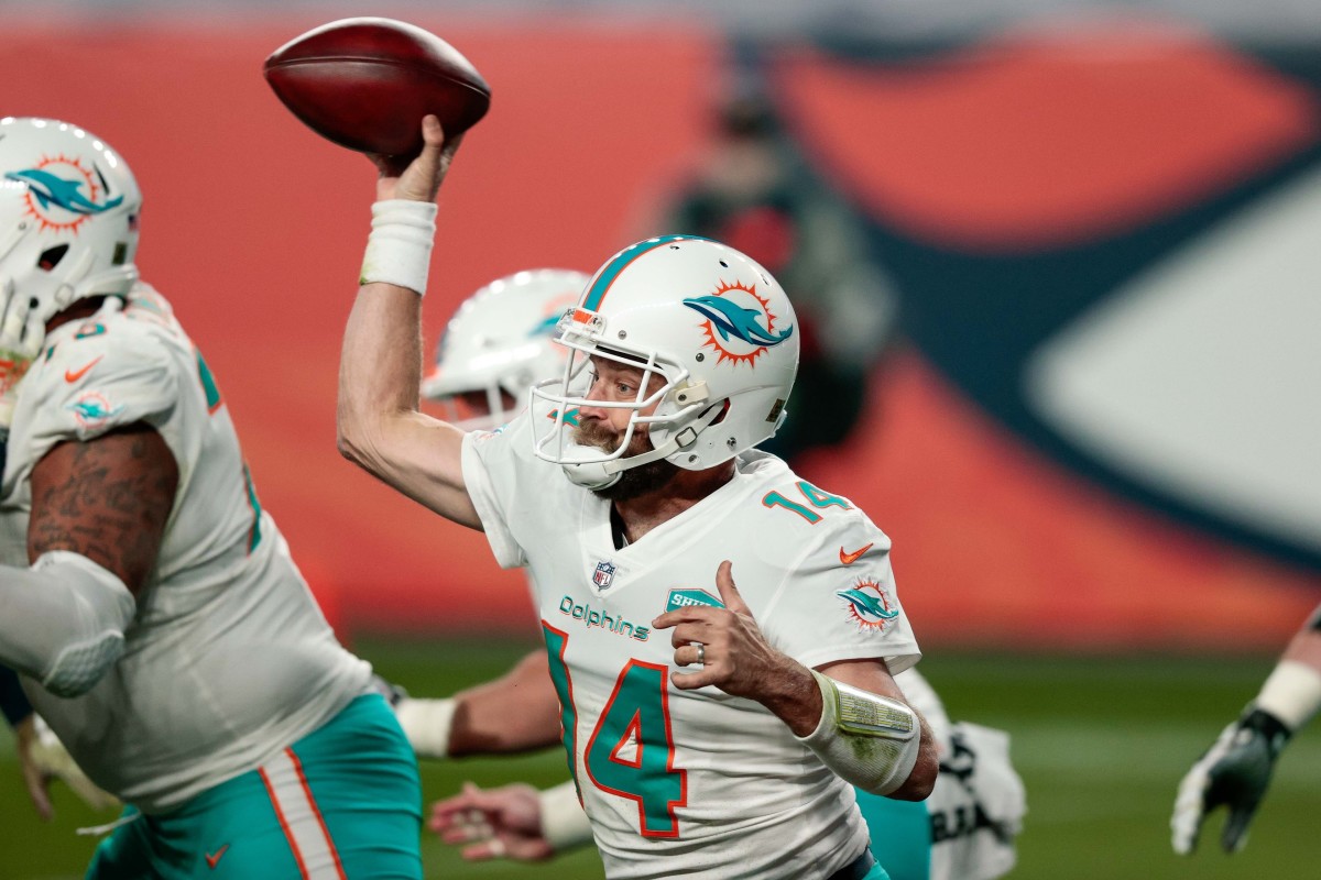 Miami Dolphins quarterback Ryan Fitzpatrick (14) throws a pass against the Denver Broncos in the fourth quarter at Empower Field at Mile High.