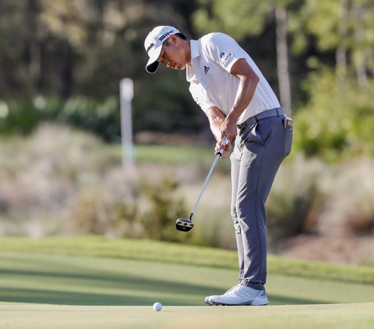 Collin Morikawa hits a putt at the Workday Championships