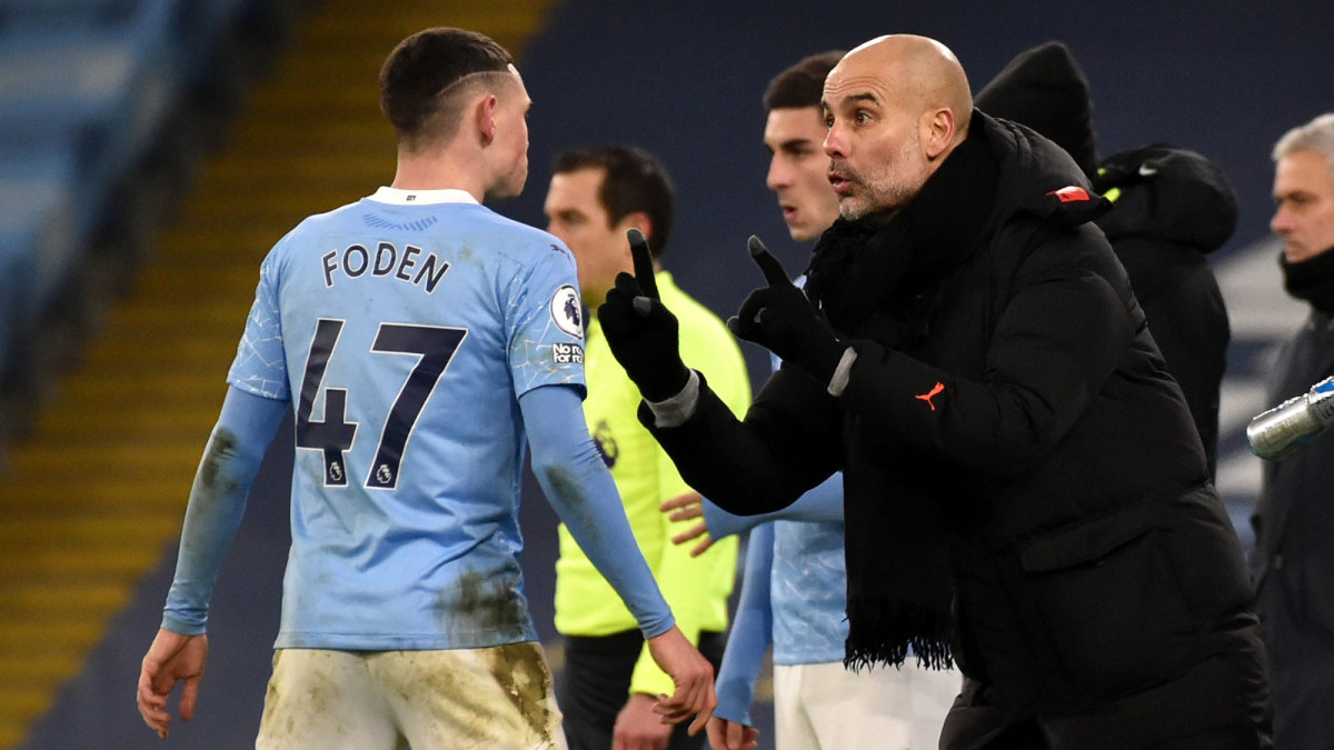Manchester City's Phil Foden and Pep Guardiola