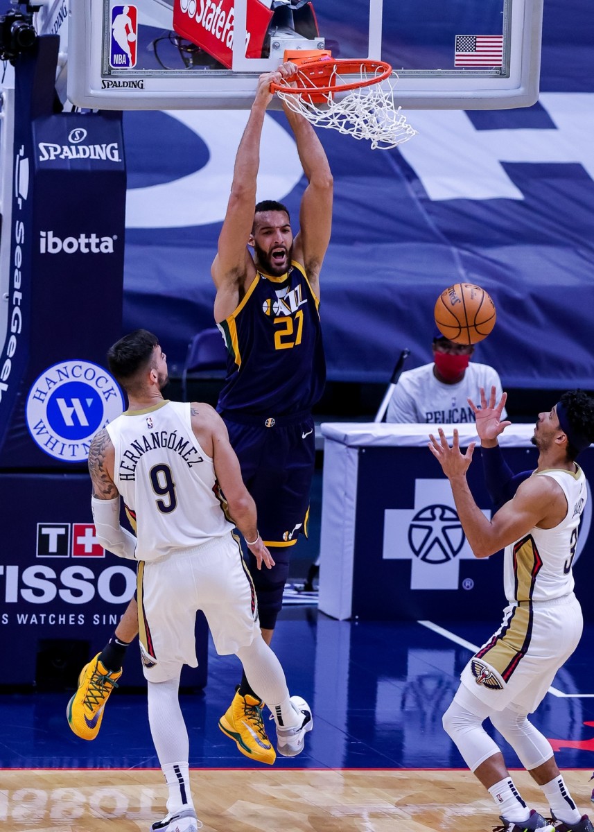 Rudy Gobert (27) dunks over a slew of New Orleans Pelicans on Monday night