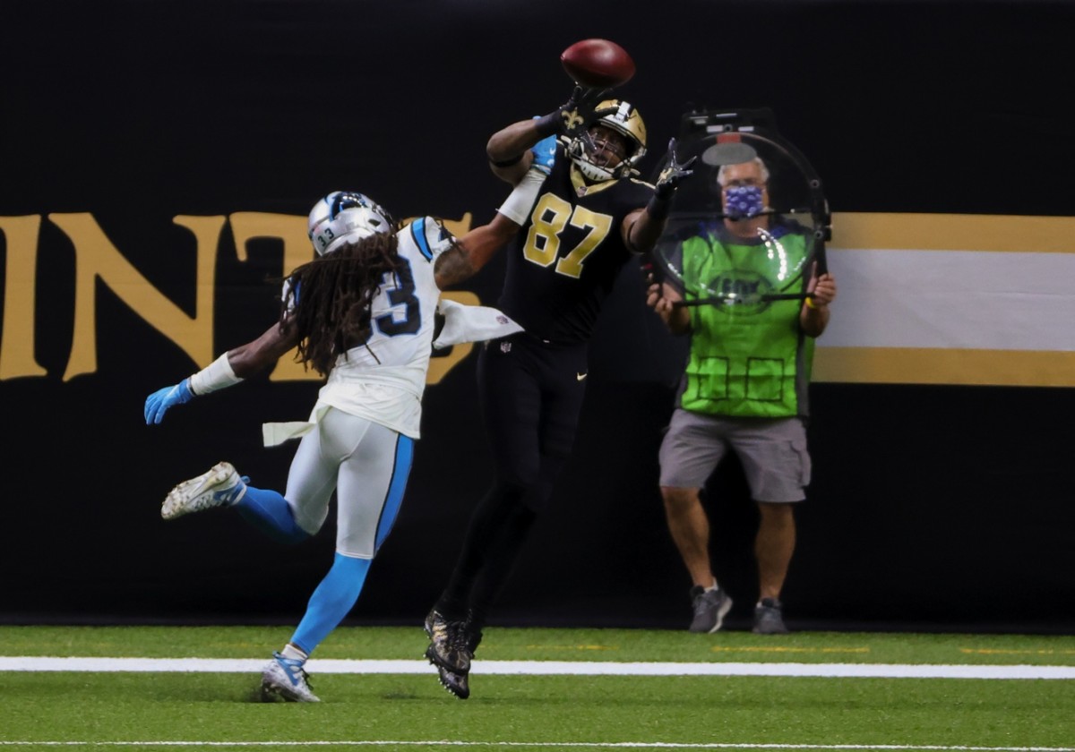 Oct 25, 2020; New Orleans, Louisiana, USA; Saints tight end Jared Cook (87) catches a touchdown over Carolina safety Tre Boston (33). Mandatory Credit: Derick E. Hingle-USA TODAY 