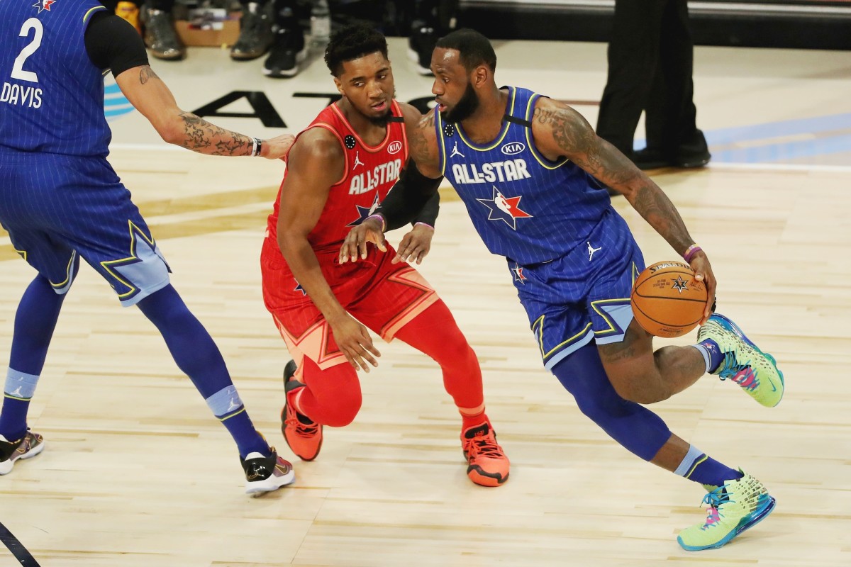 Donovan Mitchell (red) guards LeBron James (blue) during the 2020 All-Star Game