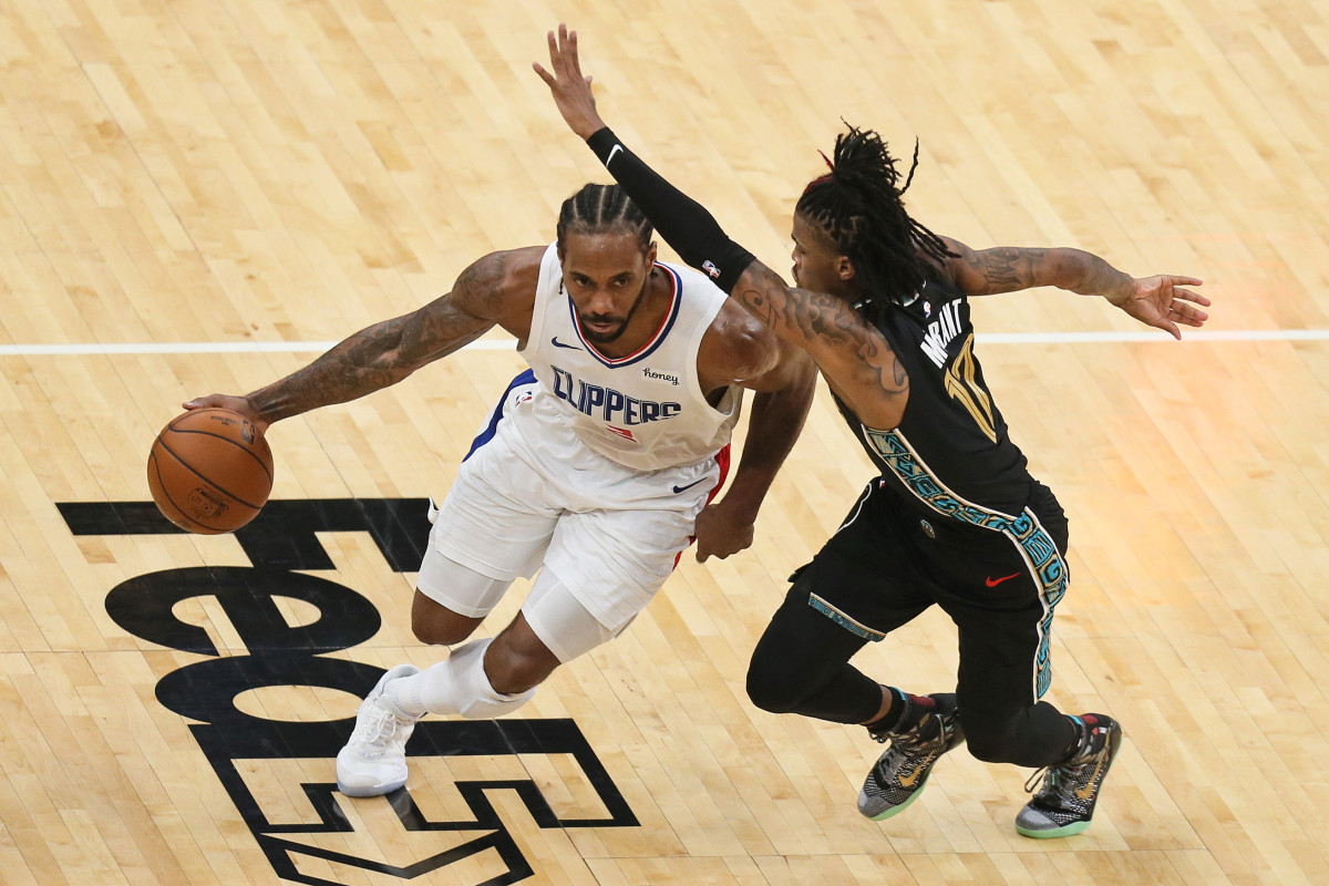 Feb 26, 2021; Memphis, Tennessee, USA; Los Angeles Clippers forward Kawhi Leonard (2) drives against Memphis Grizzlies guard Ja Morant (12) in the third quarter at FedExForum. Mandatory Credit: Nelson Chenault-USA TODAY Sports