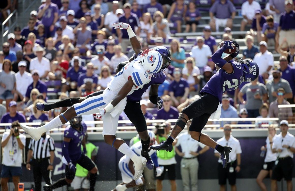 Washington intercepts a pass over Southern Methodist Mustangs wide receiver Judah Bell.