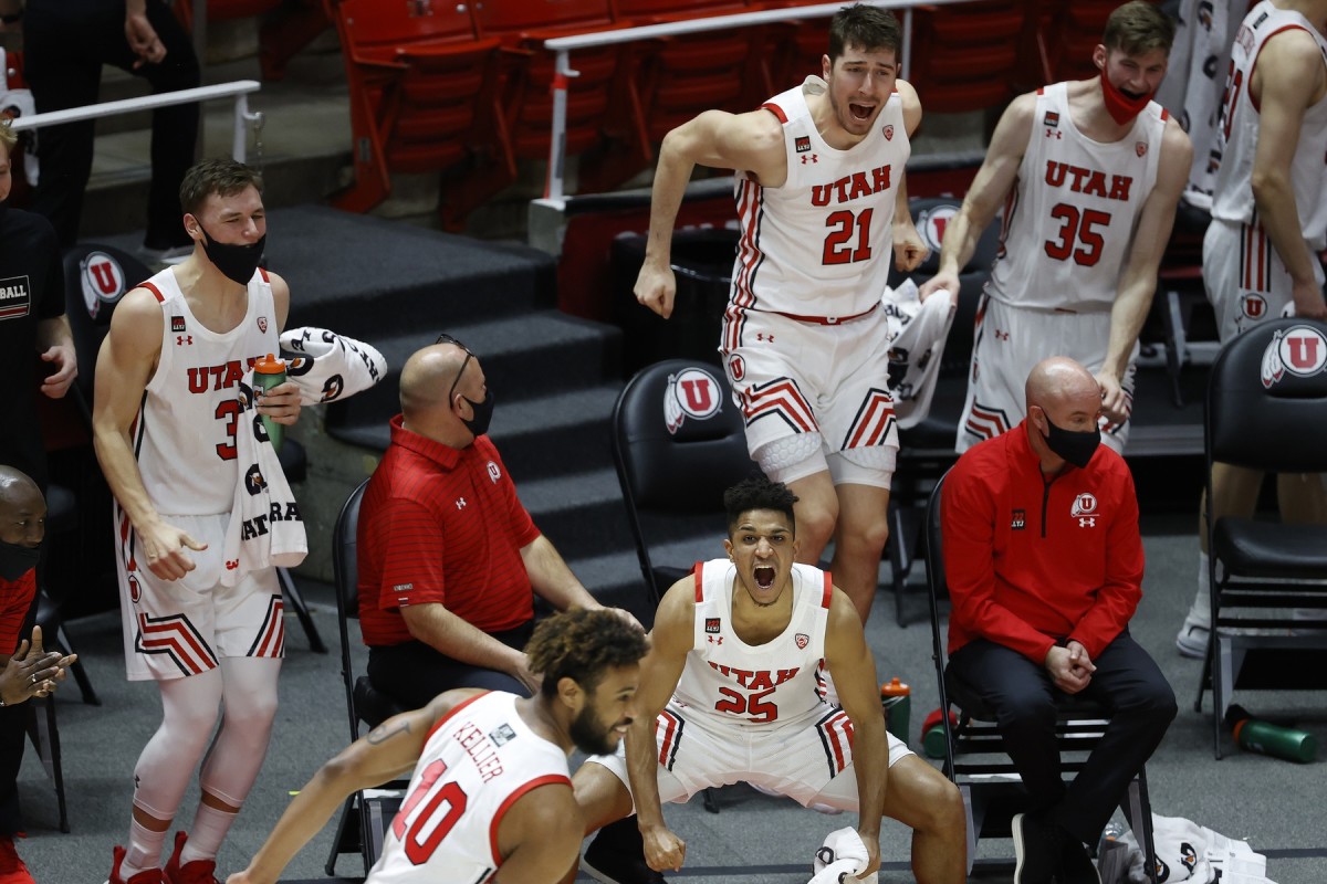 Mar 6, 2021; Salt Lake City, Utah, USA; Utah Utes guard Alfonso Plummer (25) along with the rest if the bench react to a play by guard Jordan Kellier (10) in the second half against the Arizona State Sun Devils at Jon M. Huntsman Center.