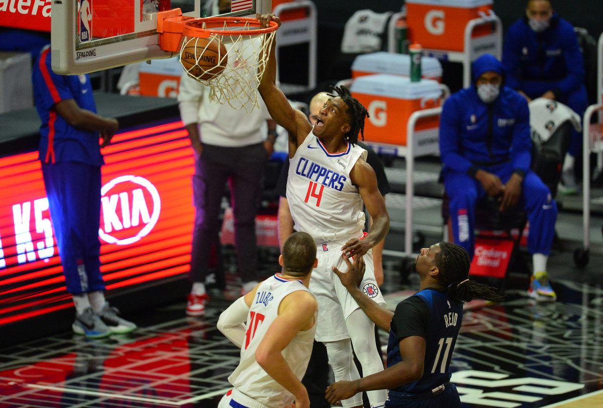 Dec 29, 2020; Los Angeles, California, USA; Los Angeles Clippers guard Terance Mann (14) scores a basket against the Minnesota Timberwolves during the first half at Staples Center. Mandatory Credit: Gary A. Vasquez-USA TODAY Sports