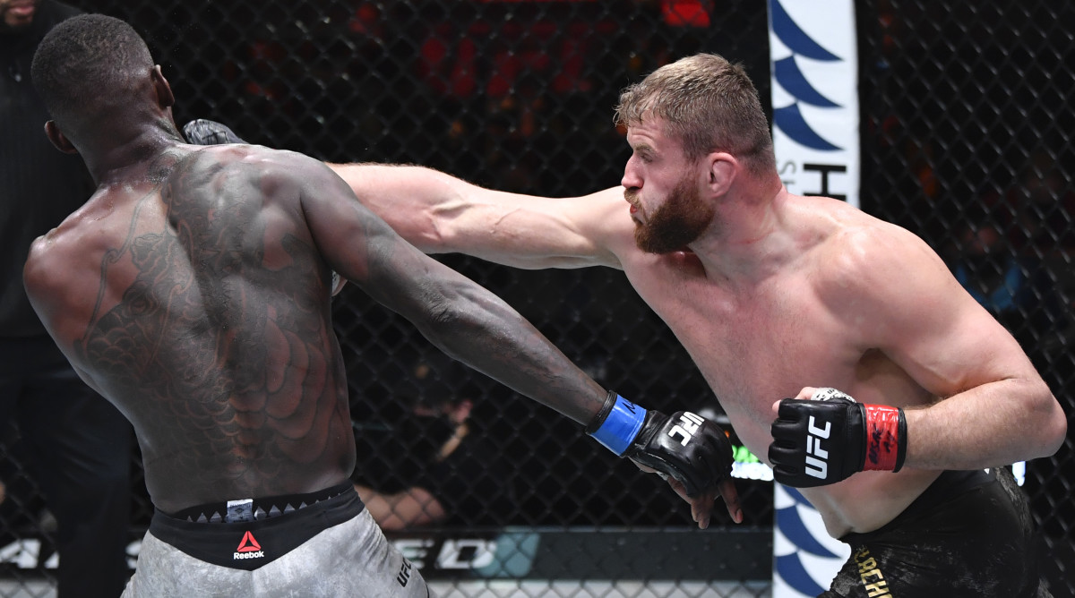 Jan Blachowicz of Poland punches Israel Adesanya of Nigeria in their UFC light heavyweight championship fight during the UFC 259 event at UFC APEX on March 06, 2021 in Las Vegas, Nevada.