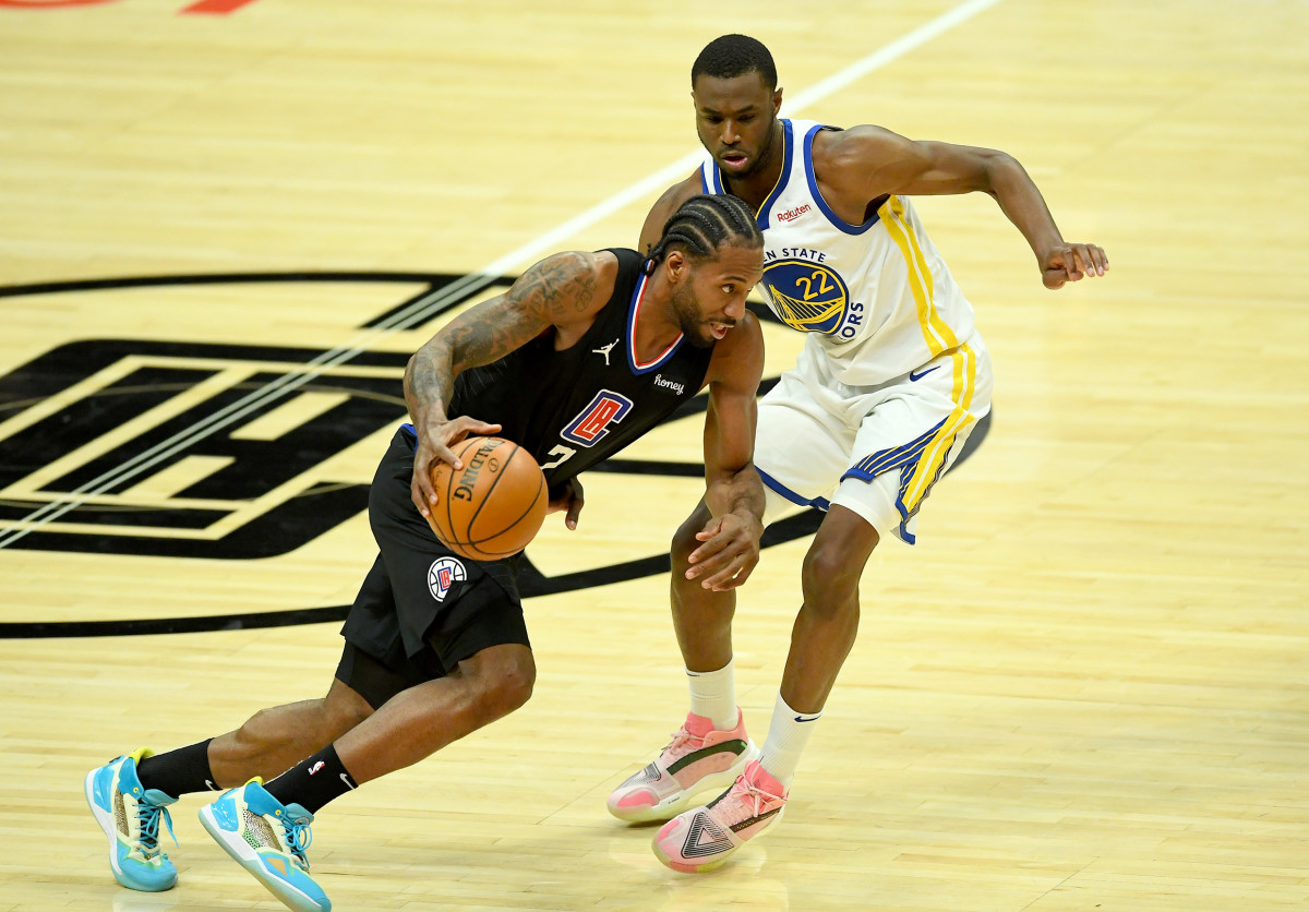 Mar 11, 2021; Los Angeles, California, USA; Los Angeles Clippers forward Kawhi Leonard (2) drives to the basket as he is defended by Golden State Warriors forward Andrew Wiggins (22) in the second half of the game at Staples Center. Mandatory Credit: Jayne Kamin-Oncea-USA TODAY Sports