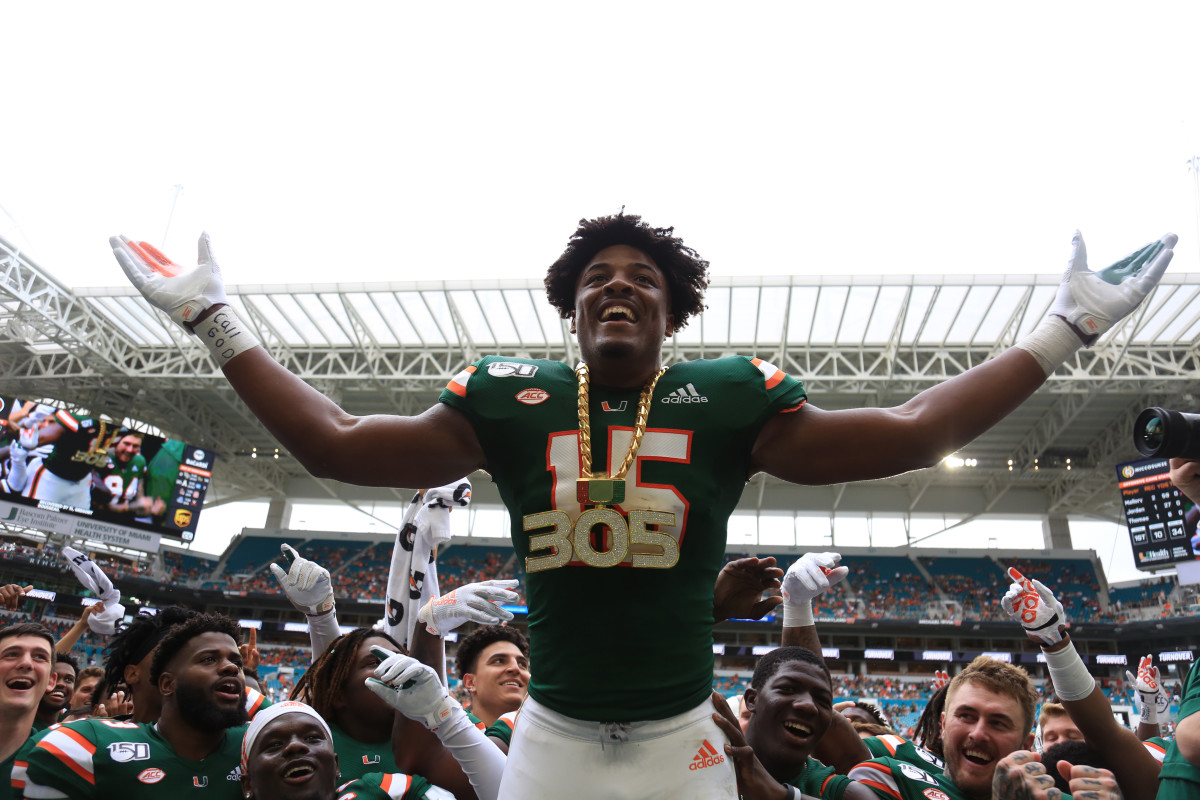Sep 21, 2019; Miami Gardens, FL, USA; Miami Hurricanes defensive lineman Gregory Rousseau (15) celebrates wearing the turnover chain during the first quarter of a football game against the Central Michigan Chippewas at Hard Rock Stadium. Mandatory Credit: Sam Navarro-USA TODAY Sports