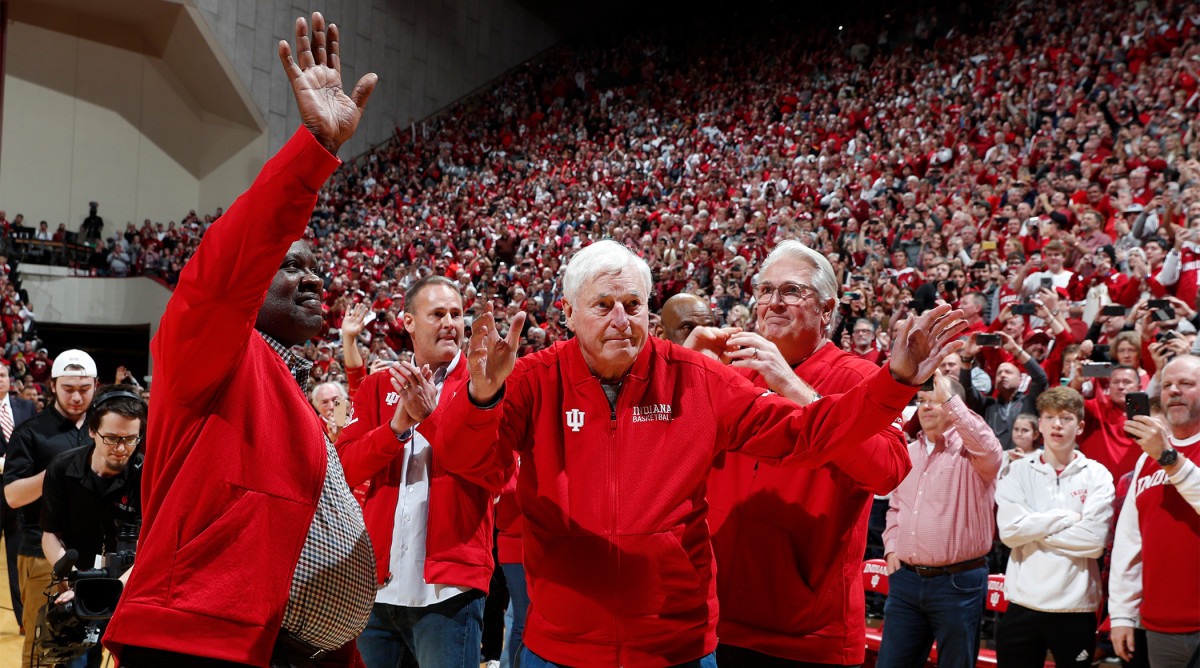 Feb 8, 2020; Bloomington, Indiana, USA; Indiana Hoosiers former coach Bob Knight returns for the first time in 20 years waves to the fans as he is escorted with his son Pat Knight and former players Quinn Buckner and Steven Green at halftime of the game against the Purdue Boilermakers at Simon Skjodt Assembly Hall.