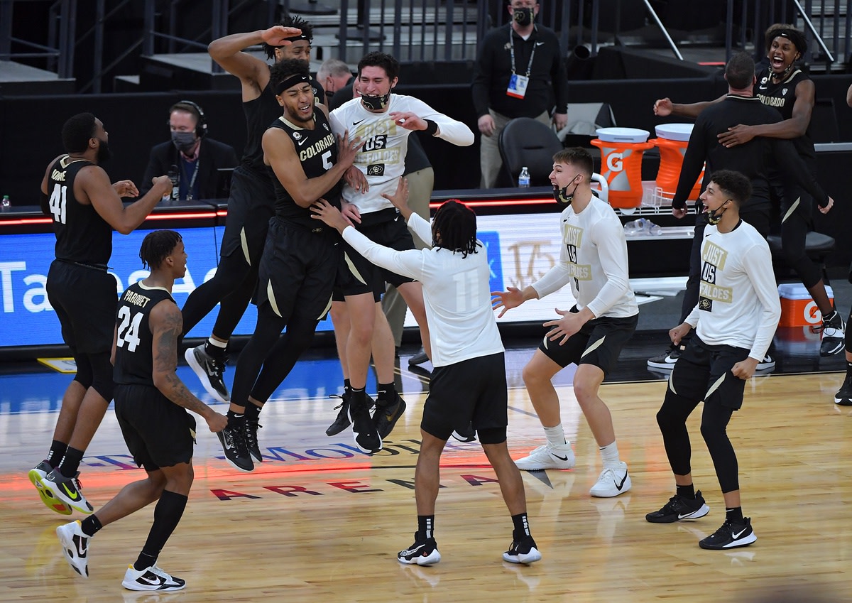 Colorado celebrates D'Shawn Schwartz's tip-in. Photo by Stephen R. Sylvanie, USA TODAY