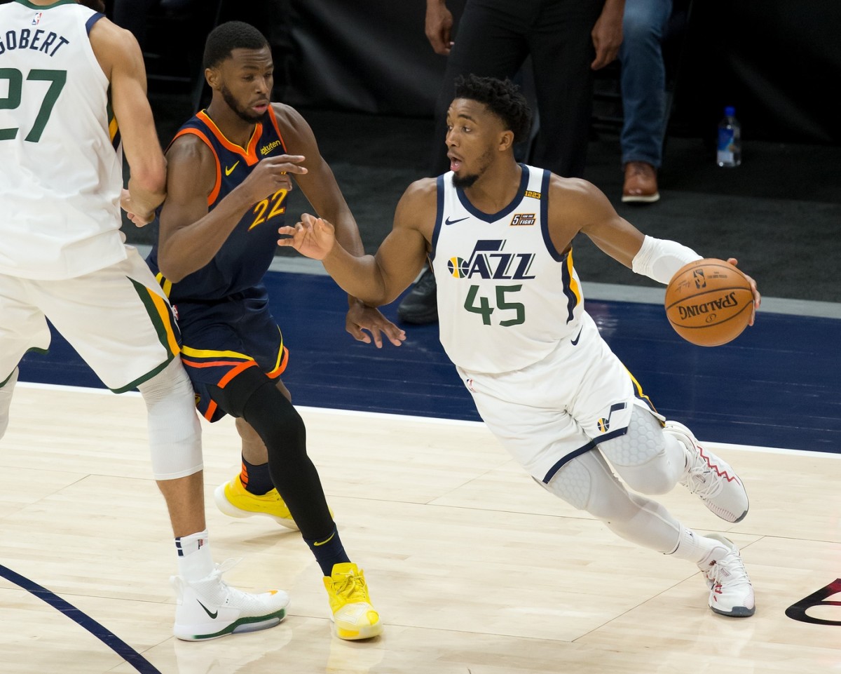 Donovan Mitchell (45) looks for an open lane against the Golden State Warriors