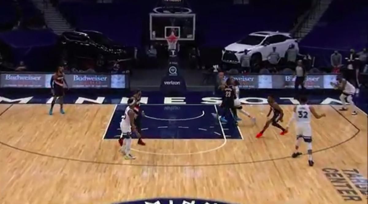 Damian Lillard is behind Robert Covington and Ricky Rubio. He's moving, but he's not all that close to the restricted area.