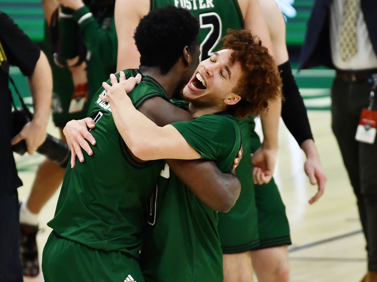 Ohio's Jason Preston hugs Dwight Wilson III in celebration