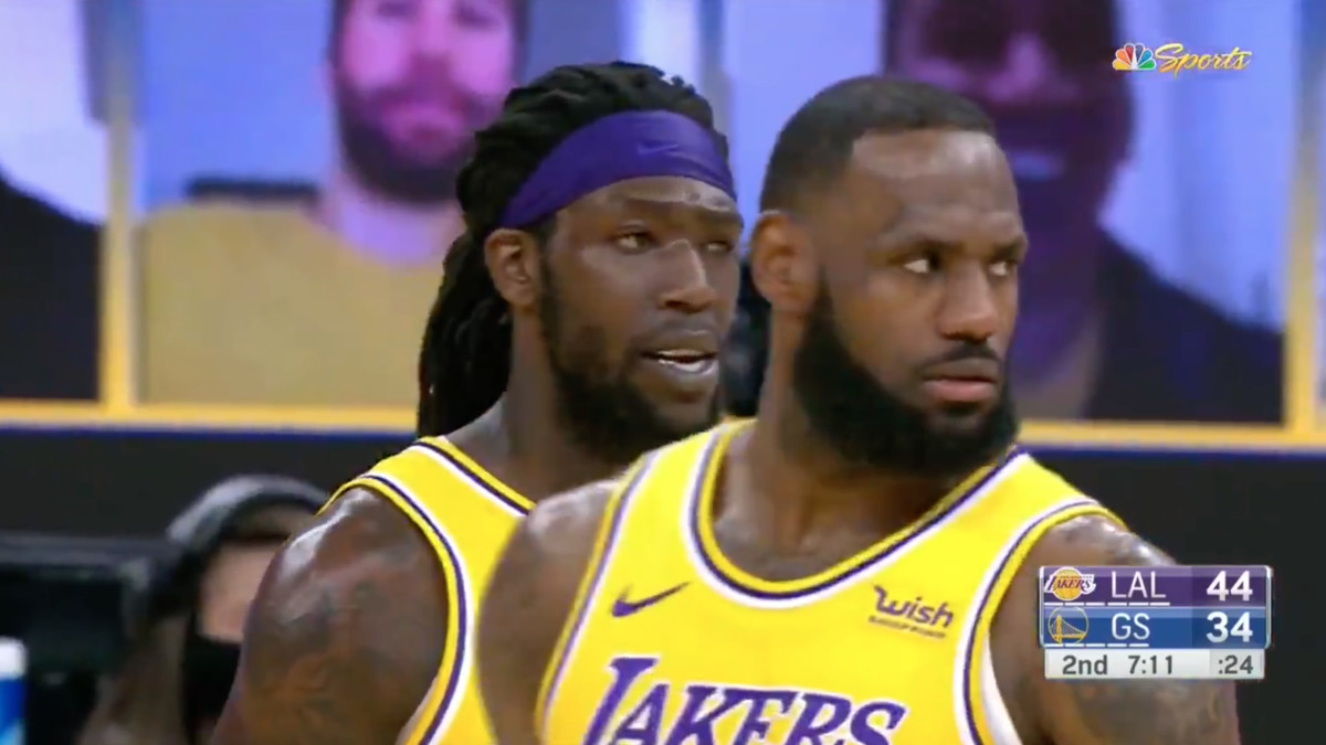 LeBron James and Montrezl Harrell glower after Kyle Kuzma's missed free throw