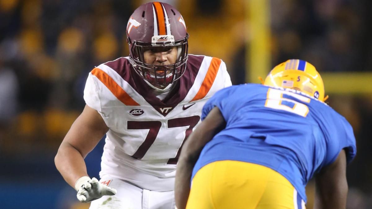 Virginia Tech Hokies offensive lineman Christian Darrisaw (77) blocks at the line of scrimmage against Pittsburgh Panthers defensive lineman Deslin Alexandre (5) during the fourth quarter at Heinz Field. Pittsburgh won 52-22.