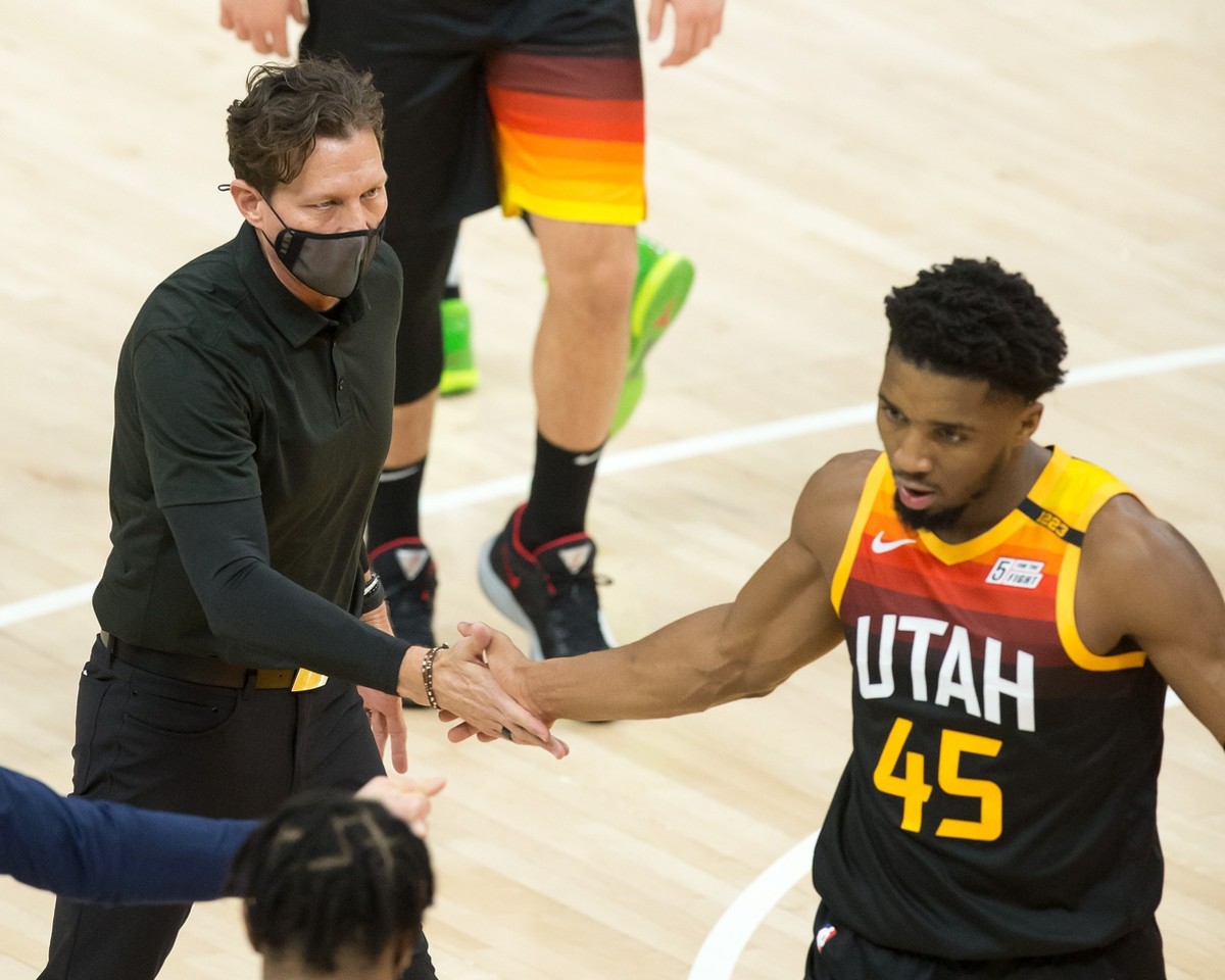 Quin Snyder (left) gives Donovan Mitchell (45) a high-five