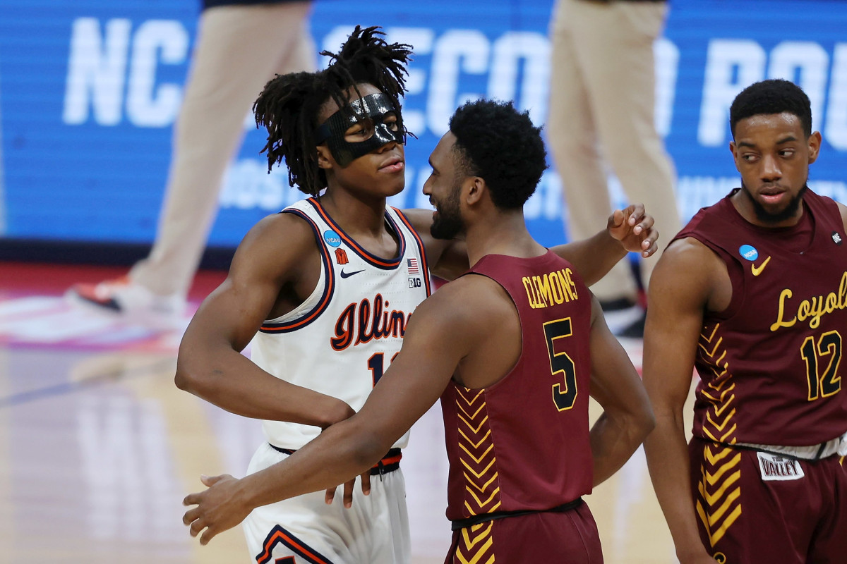 Illinois Fighting Illini guard Ayo Dosunmu (11) and Loyola Ramblers guard Keith Clemons (5) embrace after their game in the second round of the 2021 NCAA Tournament at Bankers Life Fieldhouse. The Loyola Ramblers won 71-58.