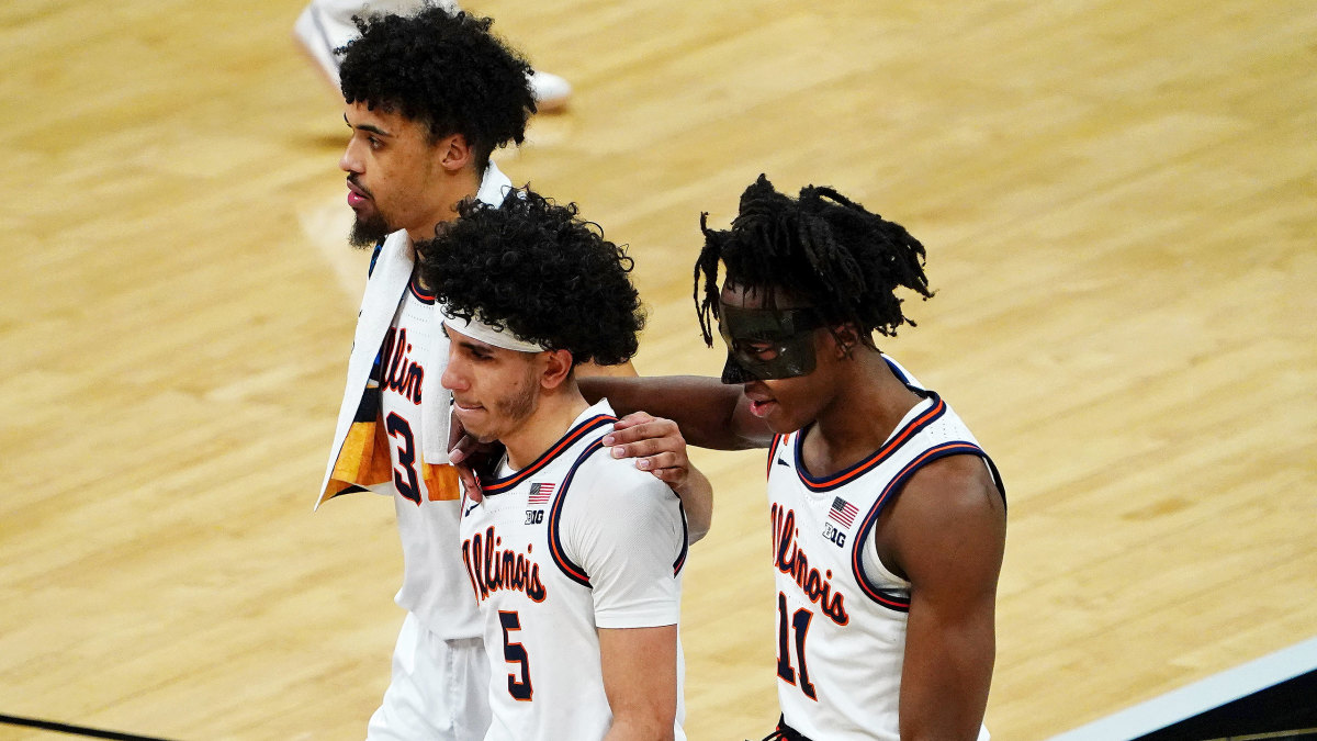Illinois players walk off the floor dejectedly after their men's NCAA tournament loss