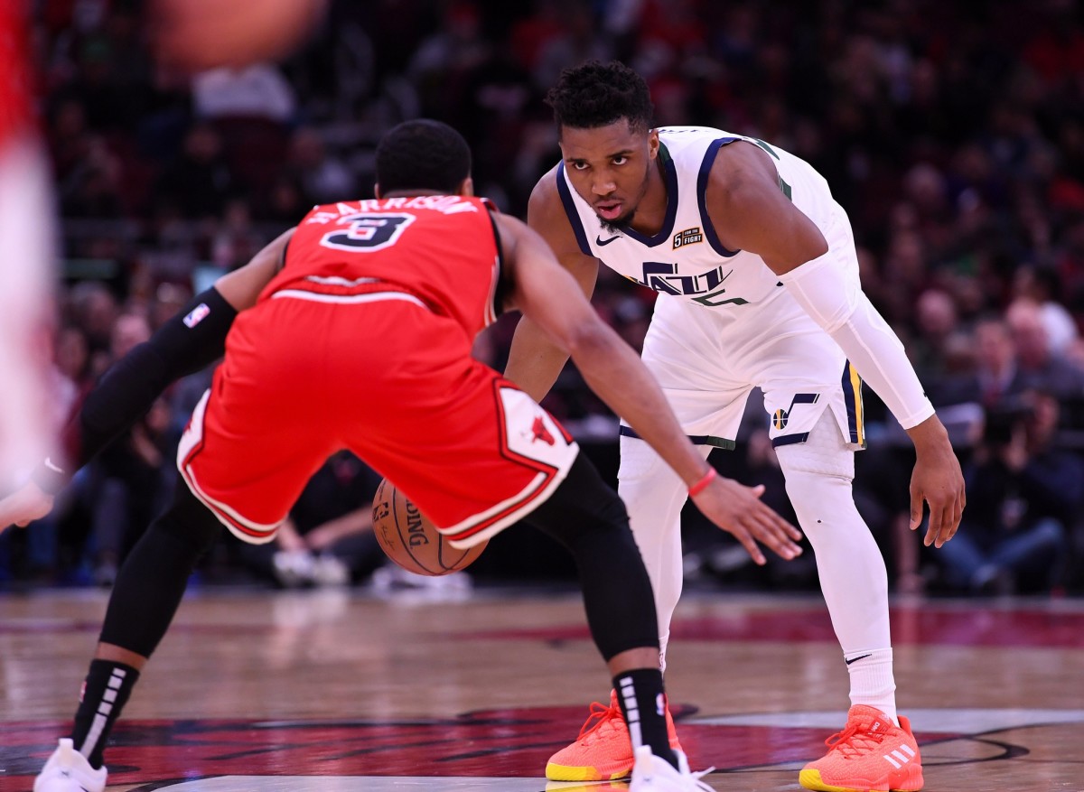 Donovan Mitchell (45) looks down Shaquille Harrison (3) in a game against the Chicago Bulls